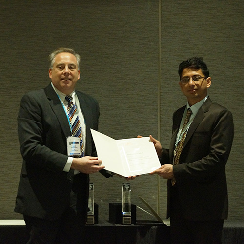 Sid Pathak receiving the Young Leaders Professional Development Award
